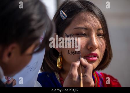 Kathmandu, Nepal. 25th Jan, 2020. An artist face paints a woman during the celebration.Tamang community celebrates Sonam Losar or New Year which occurs at the same time with the Chinese and Mongolian New Year. Credit: SOPA Images Limited/Alamy Live News Stock Photo