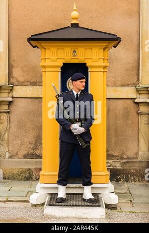 STOCKHOLM, SWEDEN - Aug 02, 2019: A guard stands stationary at his post at the Royal Palace which is in the old town (Gamla Stan) of Stockholm, Sweden Stock Photo