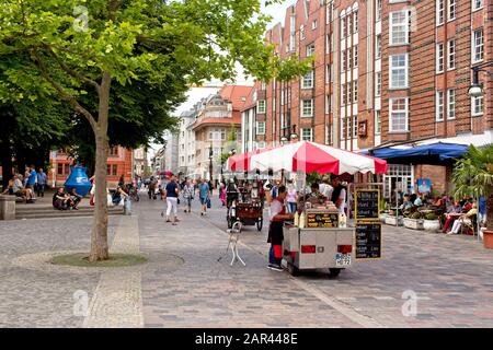 ROSTOCK, GERMANY - Dec 12, 2019: Kropeliner Strasse is Rostock's main pedestrian street which features many historic buildings and many markets stalls Stock Photo