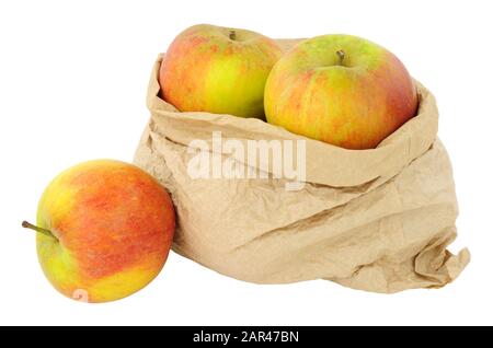Fresh apples in an environmentally friendly brown paper bag isolated on a white background Stock Photo