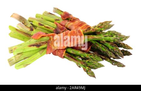 Grilled asparagus wrapped in smoked streaky bacon rashers isolated on a white background Stock Photo