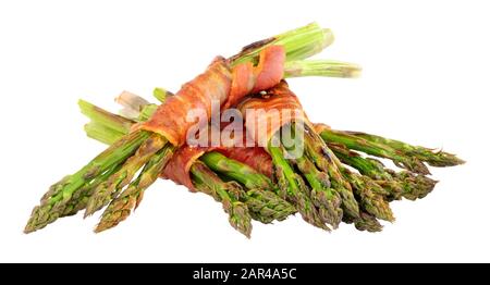 Grilled asparagus wrapped in smoked streaky bacon rashers isolated on a white background Stock Photo