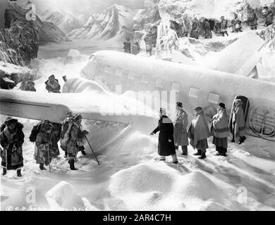 RONALD COLMAN JOHN HOWARD THOMAS MITCHELL EDWARD EVERETT HORTON and ISABEL JEWELL met by Tibetan Porters at plane crash site in LOST HORIZON 1937 director FRANK CAPRA novel JAMES HILTON screenplay ROBERT RISKIN Columbia Pictures Stock Photo