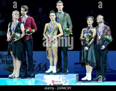 Madison Chock, right, and Evan Bates, left, come off the ice after ...