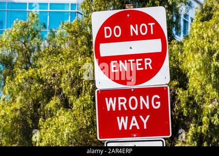 Do not Enter, Wrong Way traffic sign posted on a road Stock Photo