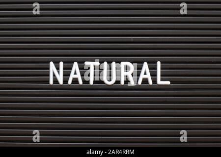 Black color felt letter board with white alphabet in word natural background Stock Photo
