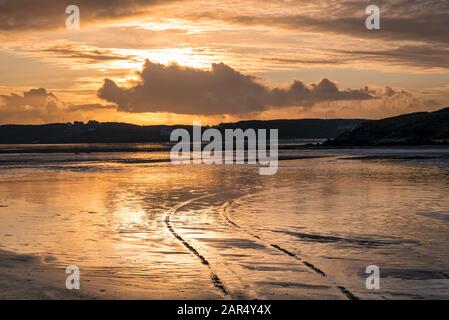 This is a beach at low tide on the coast of Donegal in Ireland taken at sunset. This is on the Wild Atlantic Way route Stock Photo