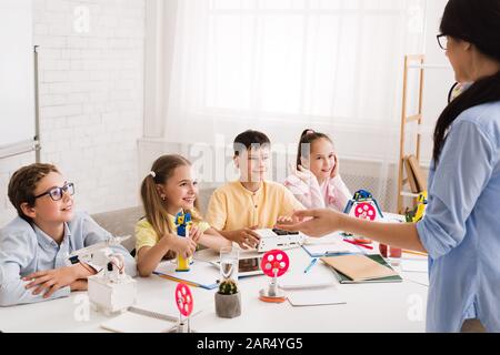 Stem lesson. Teacher explaining new robotics project Stock Photo