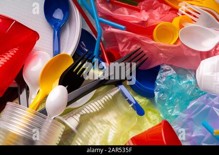 Disposable single use plastic objects such as bottles, cups Stock Photo