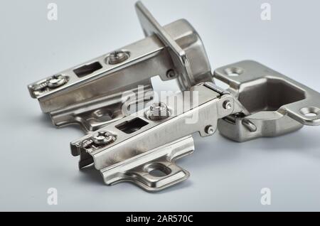 metal hinges for a cabinet on a white isolated background Stock Photo