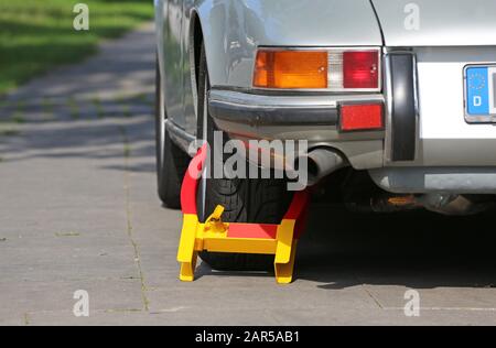 wheel clamp on Porsche old-timer Stock Photo