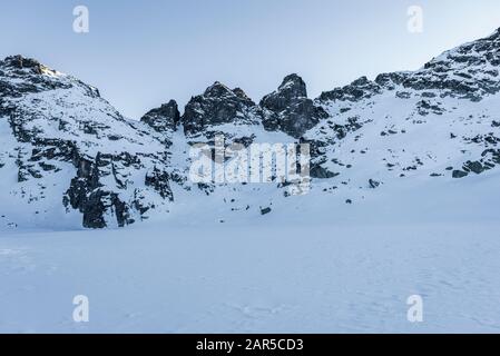 Frozen Scary lake in front of Kupens peaks in Rila mountain national park, Malyovitsa region, Bulgaria Stock Photo