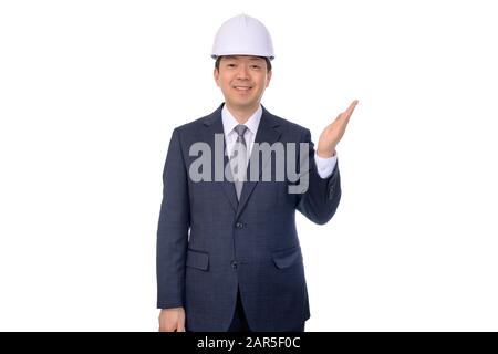 Asian middle-aged businessman making hand gestures on a white background. Stock Photo