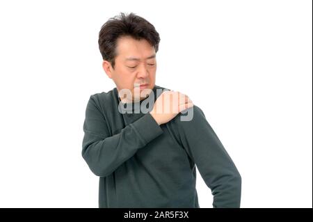 Portrait of a middle-aged man suffering in shoulder pain. Stock Photo