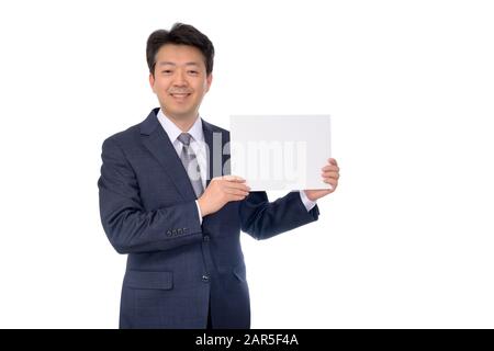 Portrait of Asian businessman holding blank message board. Stock Photo