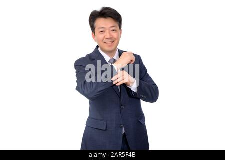 Asian middle-aged businessman making hand gestures on a white background. Stock Photo