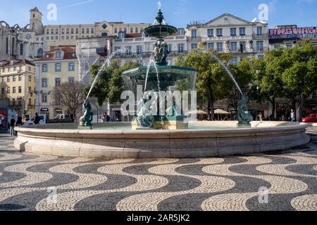 Lisbon, Portugal - January 17, 2020: Fountain of the Praça do Rossio square in the center plaza of Lisbon, Portugal Stock Photo