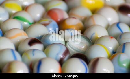 Close up of white multicolored marbles collection Stock Photo
