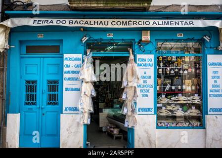 Dried codfishes for sale in Feira do Bacalhau old fashioned traditional grocery store in Porto city on Iberian Peninsula in Portugal Stock Photo