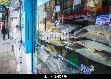 Dried codfish for sale in Pretinho do Japao old fashioned traditional grocery store in Porto city on Iberian Peninsula in Portugal Stock Photo