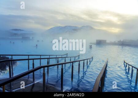 Blue Lagoon next to Reykjavik with people bathing in this natural hot spring . Stock Photo
