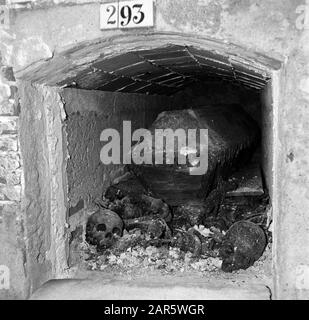 Village life and landscapes on the Catalan coast  Chest in a niche with legs and skulls Date: undated Location: Catalonia, Spain Keywords: cemeteries Stock Photo