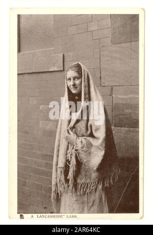 Original early 1900's  postcard entitled 'a Lancashire Lass'. The young woman is wearing a shawl typical of female mill workers at this time. U.K., circa 1906 Stock Photo