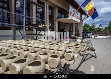 Handmade vessels drying on sun in front of Black Ceramics of Marginea centre, famous for its ancient burning technique in Marginea village, Romania Stock Photo