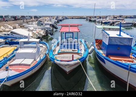 Fishing boats in Trapani city on the west coast of Sicily in Italy Stock Photo