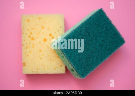 https://l450v.alamy.com/450v/2ar6db0/new-foam-sponges-for-washing-dishes-green-and-yellow-sponge-top-view-bilateral-foam-sponges-on-a-pink-background-2ar6db0.jpg