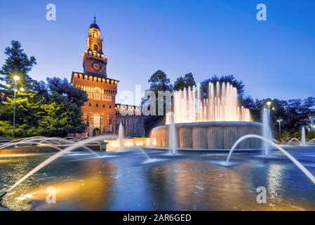 Sforza Castel (Castello Sforzesco) at night in Milan, Italy. This castle was built in the 15th century by Francesco Sforza, Duke of Milan. Stock Photo