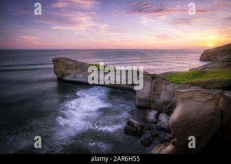 Sunset at stunningTunnel beach, New Zealand Stock Photo