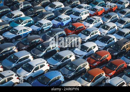Rows of new cars waiting to be sold. Stock Photo