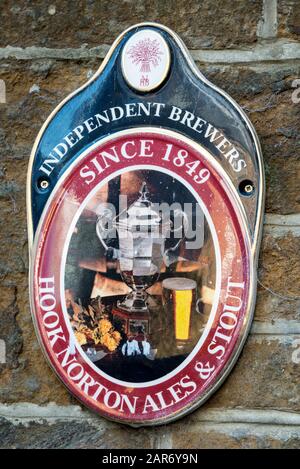 A wall sign of Independent Brewers at the family owned Hooks Norton Brewery founded in 1849, in the village of Hook Norton village in the north Oxford Stock Photo