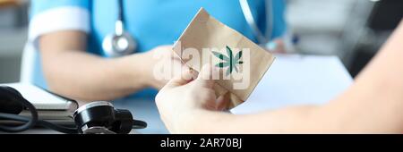 Female doctor writes prescription for medical marijuana Stock Photo