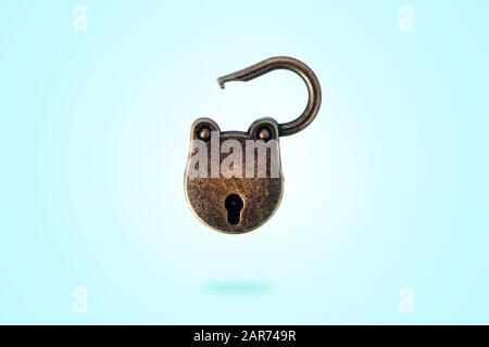 open bronze padlock levitate on a blue background Stock Photo