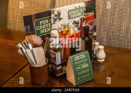 Table setting in a Greene King pub, Engine House, Torquay, part of the Punch Taverns chain. Stock Photo