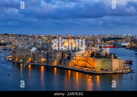 Senglea city at night in Malta, one of the Three Cities in the Grand Harbour area. Stock Photo