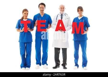 Doctors holding big red team letters isolated on white background Stock Photo