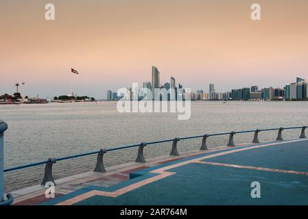 Abu Dhabi downtown waterfront skyline view at sunset, capital of the United Arab Emirates Stock Photo
