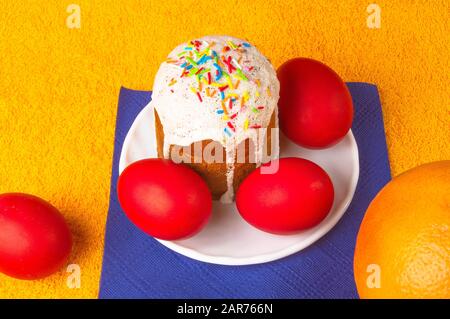 Kulichi, traditional Russian Easter cake with icing and dyed eggs Stock Photo