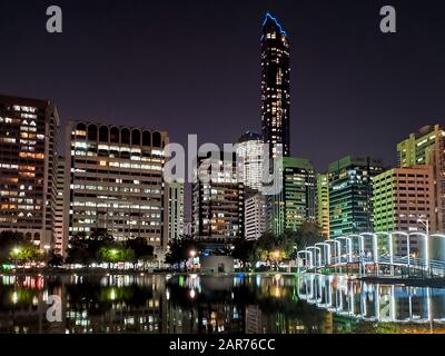 Abu Dhabi downtown cityscape reflected in the water at the Lake park Stock Photo