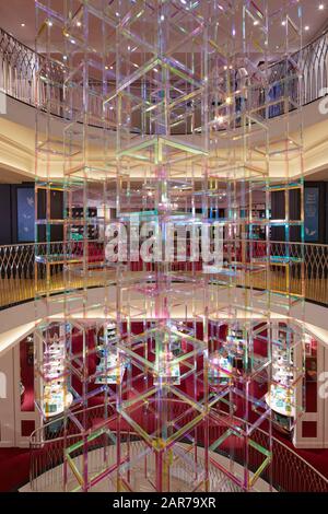 Suspended light sculpture in full-height atrium. Iri-Descent , Fortnum & Mason, London, United Kingdom. Architect: Liz West, 2019. Stock Photo