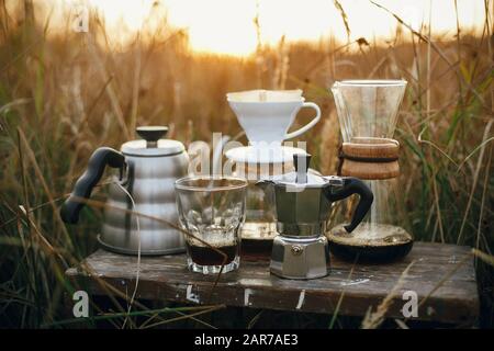 A drip coffee set with a Steel kettle, glass, and hand drip coffee