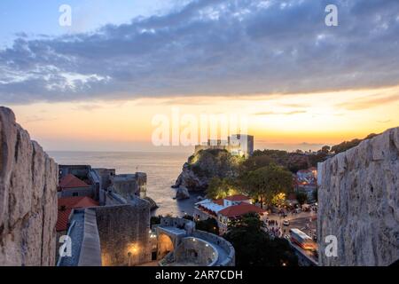 Sunset over Dubrovnik city walls within sight of Fort Lovrijenac. Croatia Stock Photo