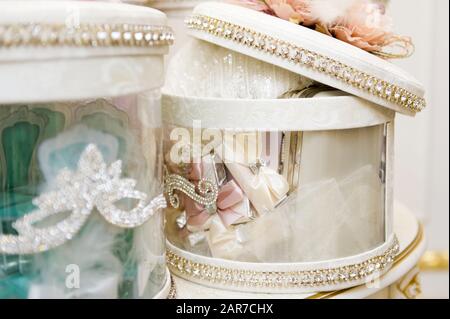 large bright round gift boxes with transparent walls with slightly open lids. close up Stock Photo