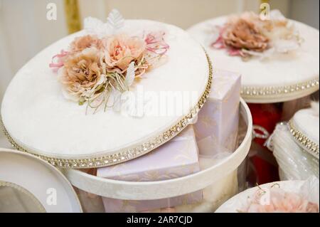 large bright round gift boxes with transparent walls with slightly open lids, close up Stock Photo