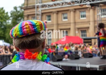 Man wearing rainbow coloured cap at Pride event, Castle square, Chester Stock Photo