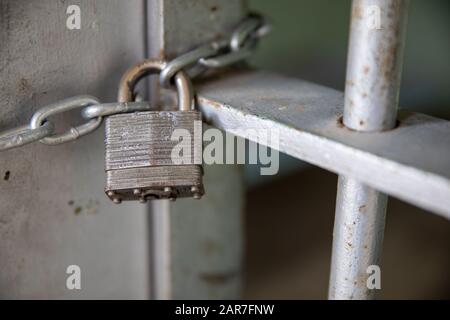 Chaing and lock holding a door closed Stock Photo