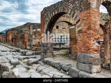 Street in Pompeii, Italy. Pompeii is an ancient Roman city died from the eruption of Mount Vesuvius in 79 AD. Stock Photo